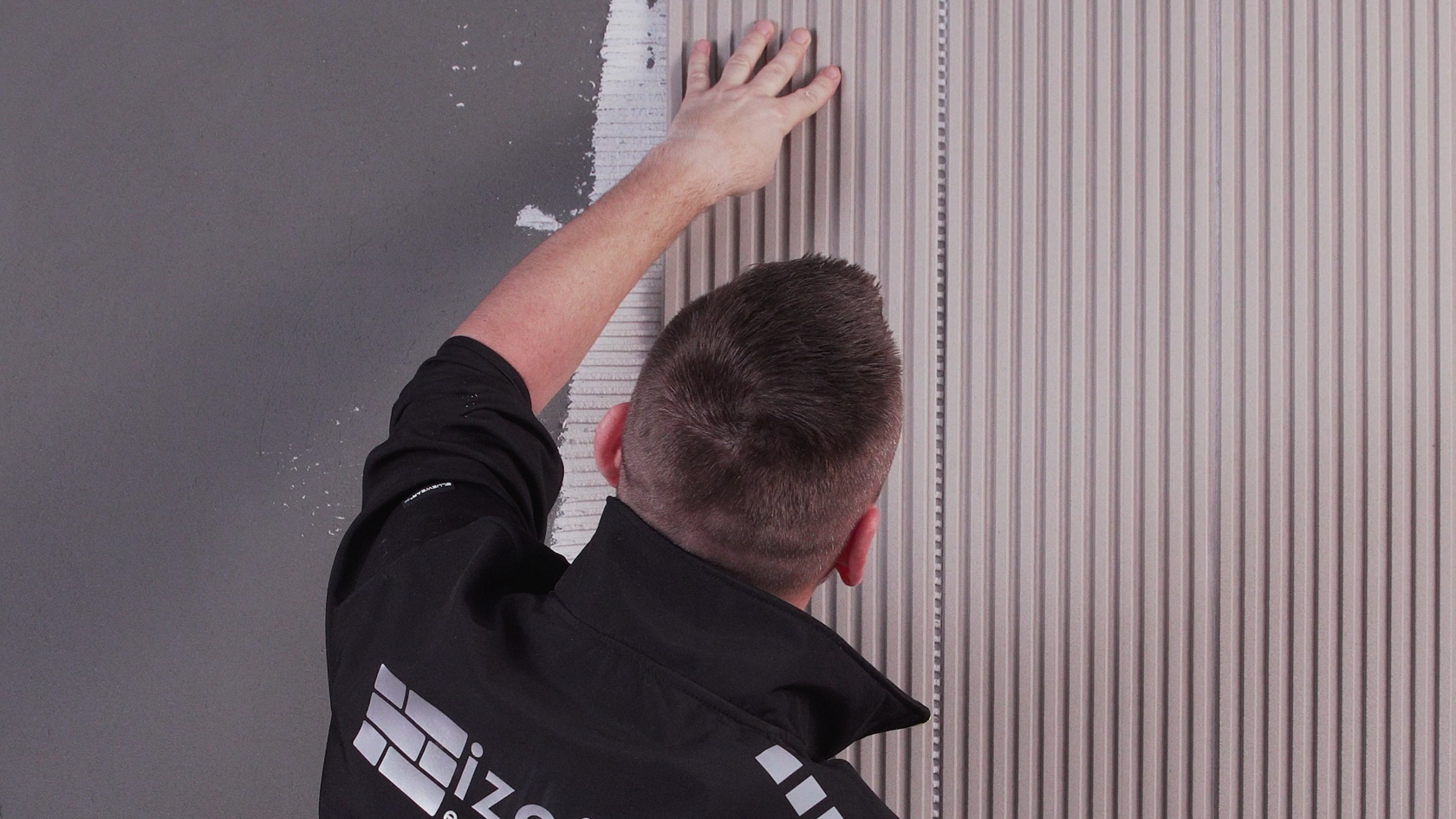 Begin installation from the corners, placing the panels in vertical strips.