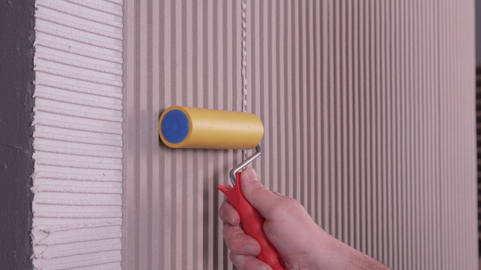 After placing the panels, press them firmly with a wallpaper roller to ensure optimal adhesion.